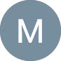 Circle with a muted blue-gray background and a white letter M centered inside